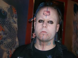 Hello Kitty cyber goth weird tattoo on forehead