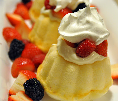 This easy fresh strawberry berry trifle with angel food cake recipe just combines angel food cake, vanilla pudding & Cool Whip topped with fresh berries to make a light red, white, and blue summer dessert.