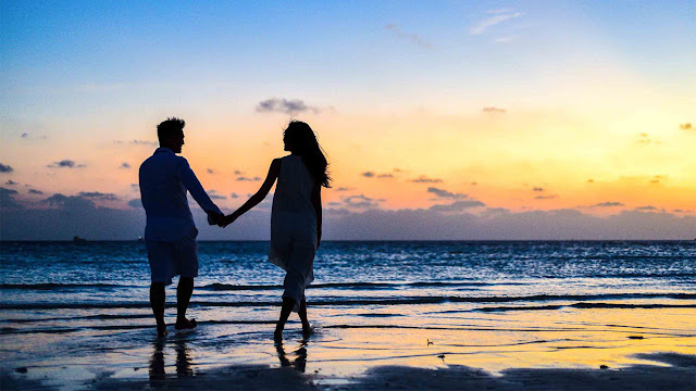 Couple Holding Hands on Beach Sunset Sunrise