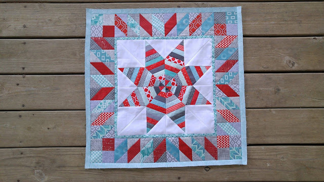 red and aqua round robin quilt
