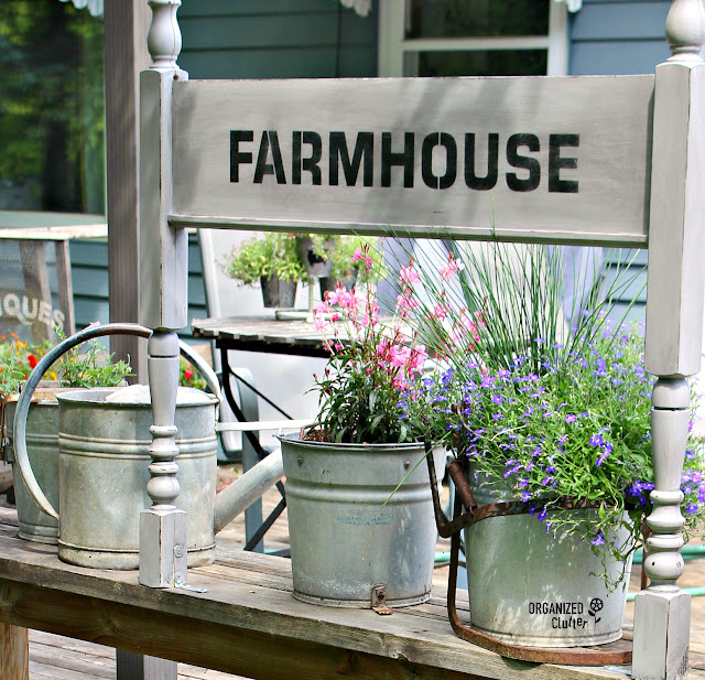 Foot-board Farmhouse Sign on the Deck #upcycle #stencil #oldsignstencils #decoart #farmhouse #junkgarden #gardenjunk #containergarden