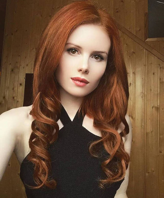 Cute long hair redhead secretary