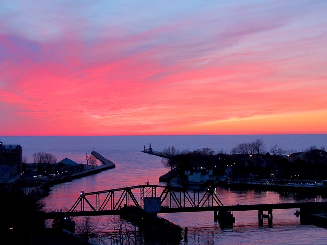 Beach, Bridge and Town at Sunset on Lake Michigan Beach, Bridge and Town at Sunset on Lake Michigan