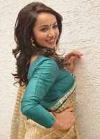 Tejaswi Madivada in Saree Photos at V Care Fundraiser Event TollywoodBlog