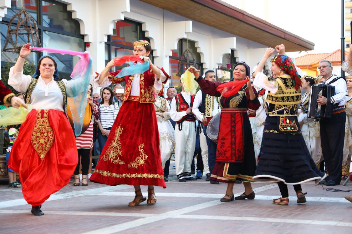 Albania Holidays DMC Tourist enjoy dancing folk music at New Bazaar in