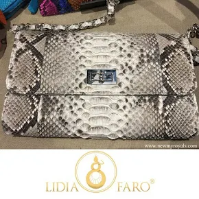 Queen Letizia carried Lidia Faro python skin clutch bag
