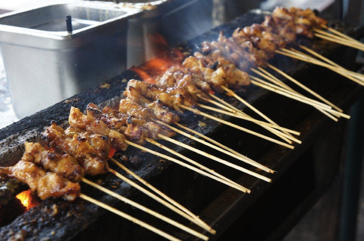 Chicken satay grilling in Kajang, Malaysia - featured on SeasonWithSpice.com