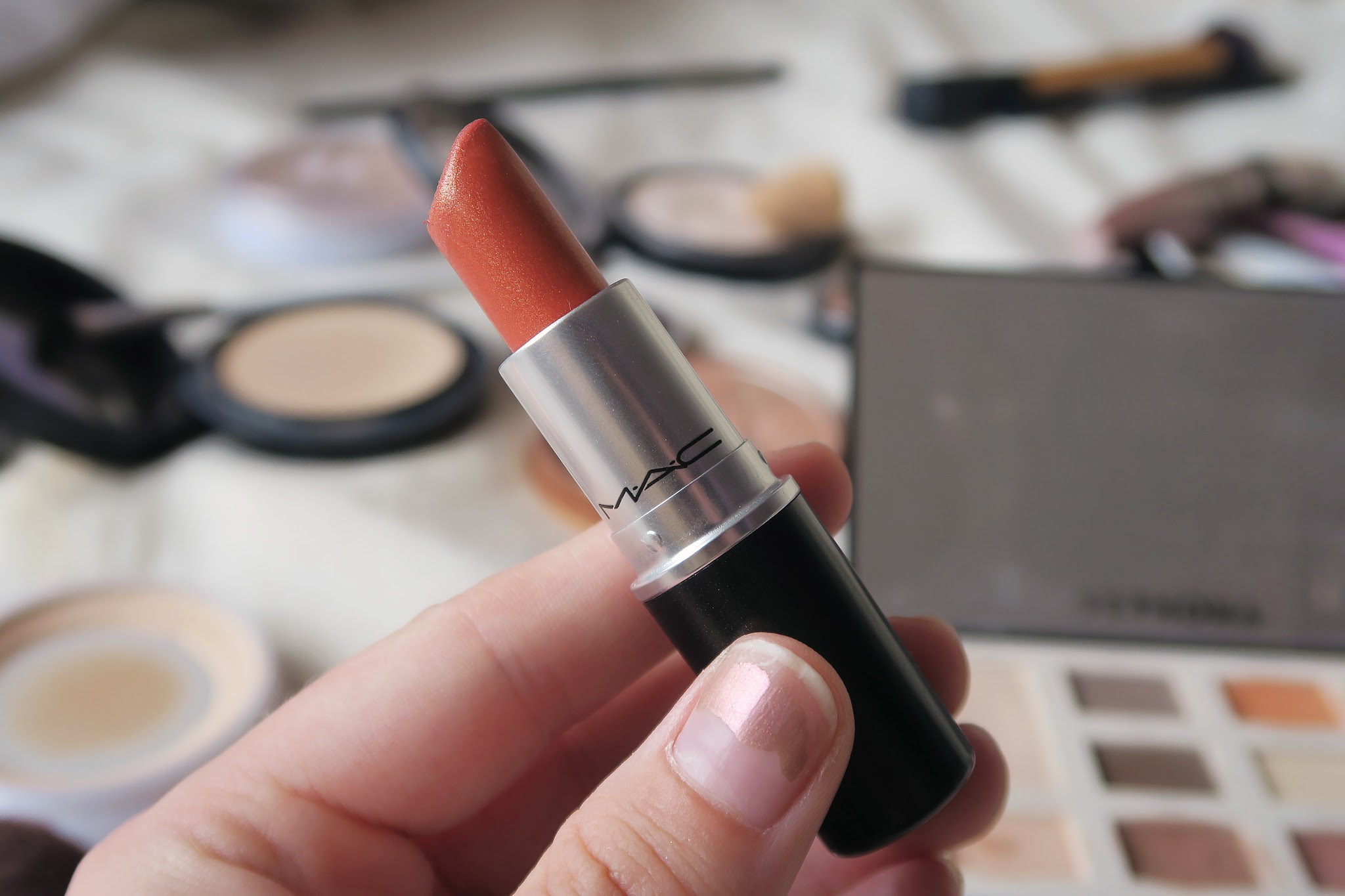 An image of an orange lipstick