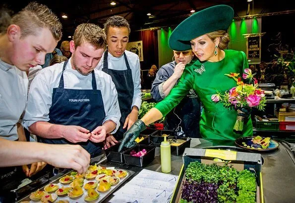 2018 Dutch Organic Trade Fair at IJsselhallen Convention Center in Zwolle. Queen Maxima wore Natan dress and Natan shoes, green diamond earrings