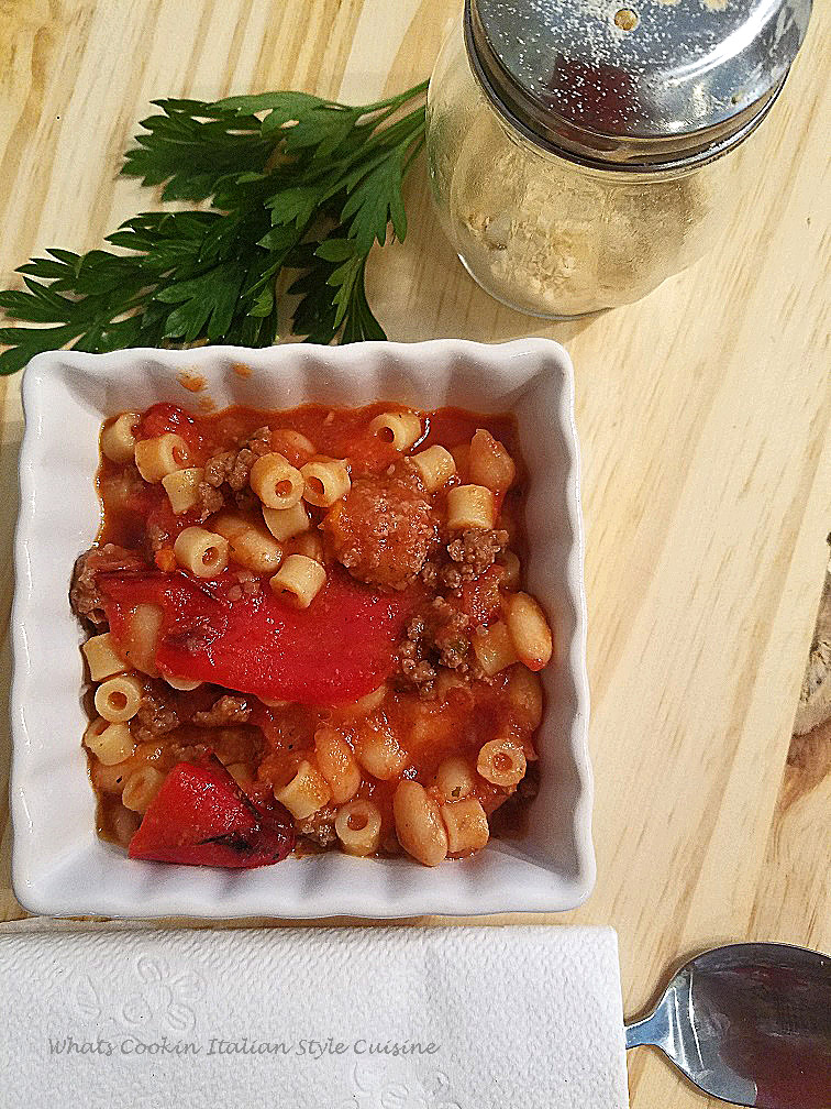 Italian style goulash is a classic American dish changed into an Italian American sauce. This goulash is filled with the freshest ingredients and easy to make. This goulash Italian style has fresh tomatoes, peppers and garlic in it with hamburger and using ditalini pasta in place of the elbow macaroni. The peppers in this dish are long red peppers sauteed in this pan with hamburger meat . There are also added cannelini beans in this photo