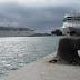 a ship ashore and another ship in the sea