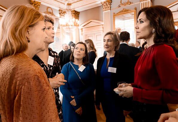 Crown Princess Mary wore a red sil blouse by Hugo Boss. Boss Banora8 blouse. black embroidered skirt at Christmas reception