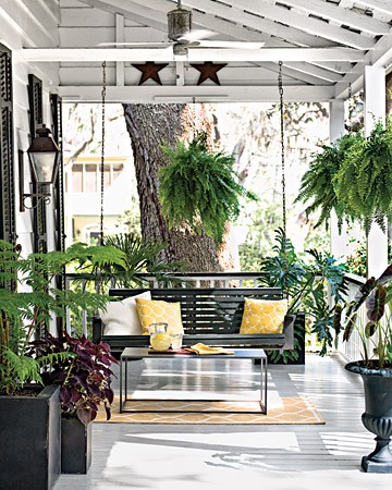 This black and white front porch decor looks modern and sleek with great pops of vibrant green