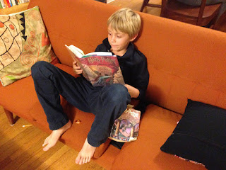 Boy reading Harry Potter
