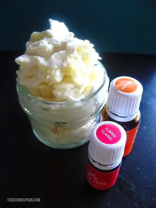 Learn how to make an easy, non-toxic whipped body butter recipe using coconut oil, cocoa butter, jojoba oil and essential oils. It will make you feel luxurious and moisturize your skin without putting a big dent in your wallet.