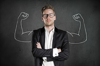 A photograph of a business man with cartoon strong arms drawn cartoon-fashion behind him