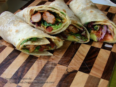 Flatbread wraps with cripsy chicken, avocado and mixed salad leaves