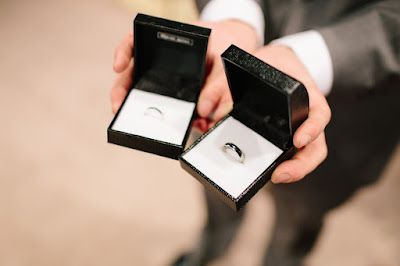 K'Mich Weddings - wedding planning - hand holding ring box