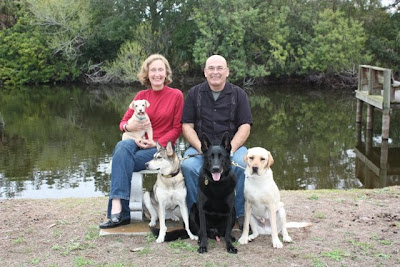 Family photo - with Toby's human family, and their other 3 dogs (Toby is on the far right)