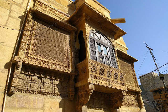 a typical yellow sandstone sculptured window in Jaisalmer a typical yellow sandstone sculptured window in Jaisalmer