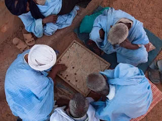 Moorish men playing Mancala a Math Game