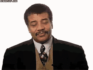 Neil Degrasse Tyson waving hands and looking grossed out