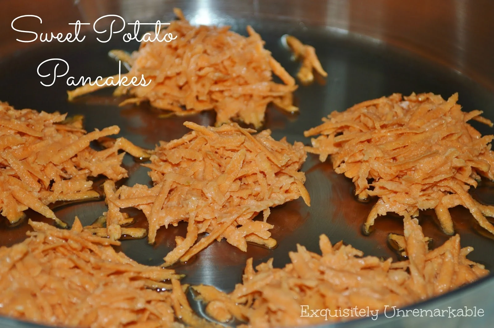 Shredded sweet potato pancakes in a pan