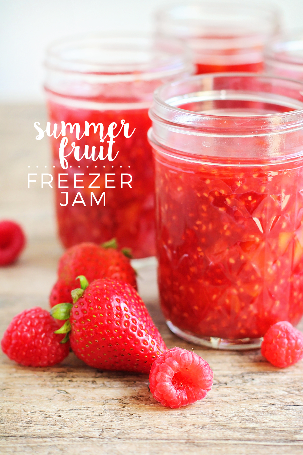 This summer fruit freezer jam is the perfect way to use all that delicious summer fruit! It's ready in less than thirty minutes, and stays fresh in the freezer so you can enjoy it all year long!