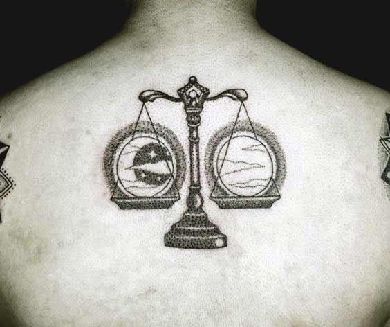 Libra tattoo design with moon and sun on back
