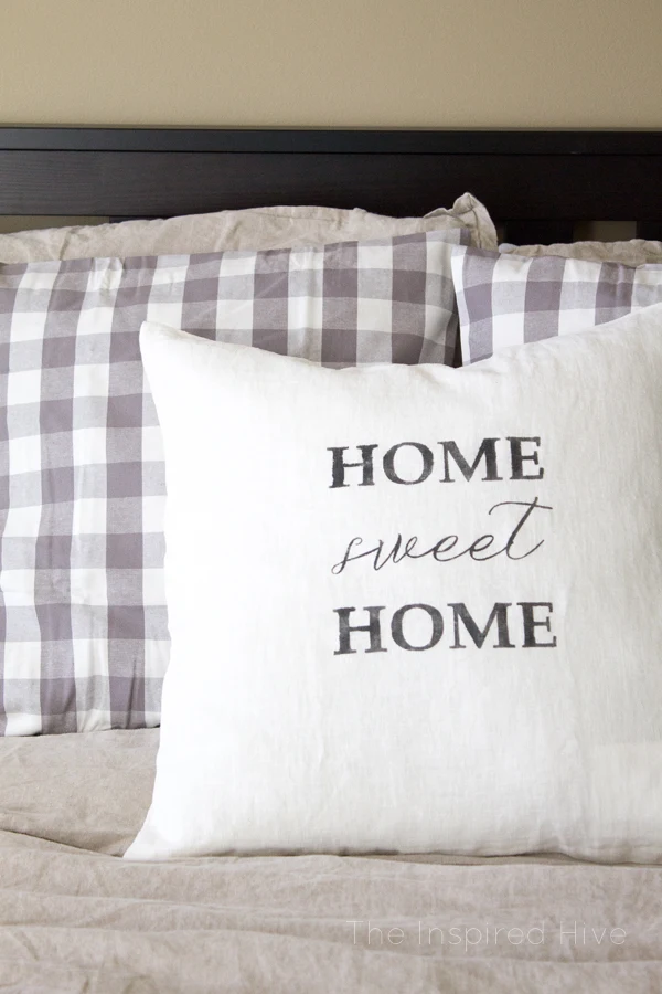 How to use Silhouette to make a DIY stenciled farmhouse style throw pillow.