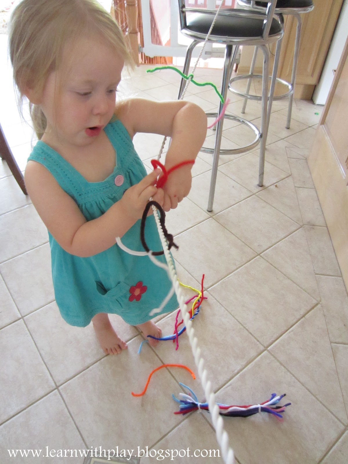 Learn with Play at Home Fine Motor Pipe cleaners on a String