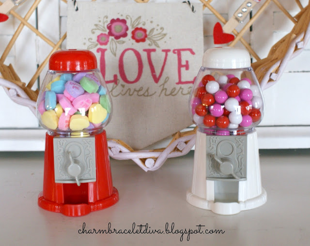 Mini gumball machines filled with conversation hearts and candy coated chocolate
