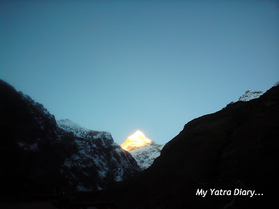 The glowing Neelkanth peak in the Garhwal Himalayas, Uttarakhand 

during sunrise