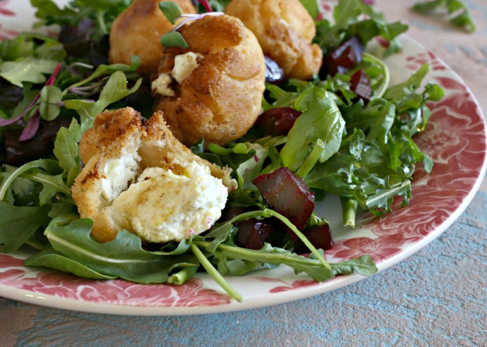 Crispy goat cheese filled dough puffs served over salad.