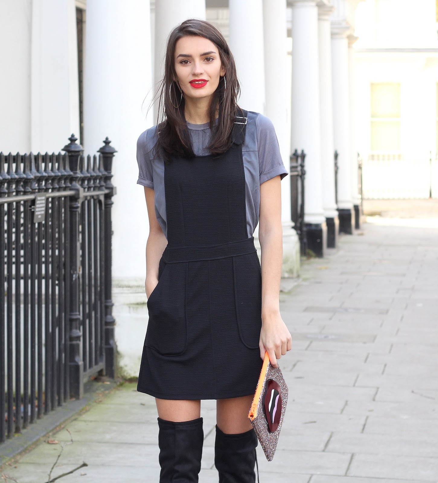 peexo fashion blogger wearing black pinafore dress and knee high boots