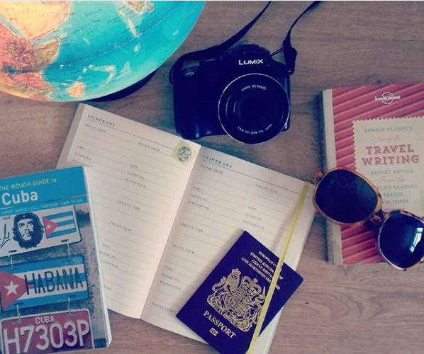Travel planning, including globe, notebook, passport and Cuba travel guide Travel planning, including globe, notebook, passport and Cuba travel guide