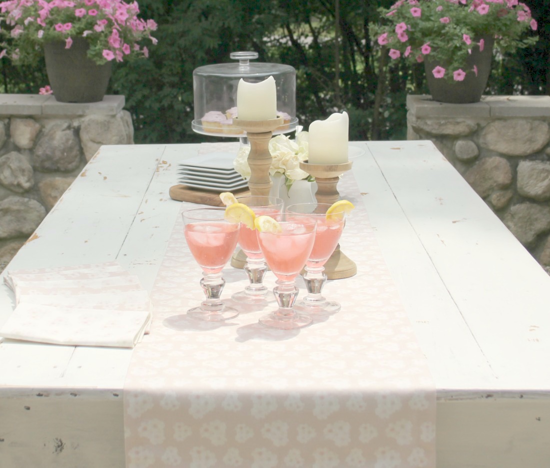 White farm table with blush pink table runner - Hello Lovely Studio