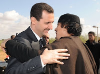 Syrian President al-Assad and former Libyan leader Col. Gaddafi