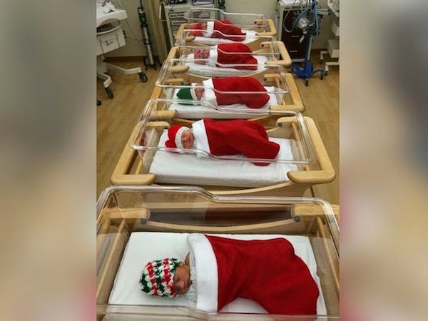 babies wrapped santa stockings