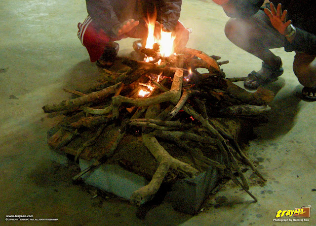 Warming by the campfire at The Silver Oak homestay Ponnampet, Kodagu district, Karnataka