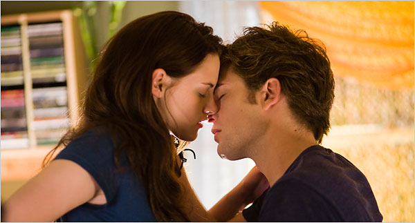 Bella and Edward Cullen share a tender moment in Twilight 2008 movieloversreviews.filmiinspector.com