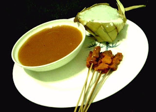 Tausug Satti served with rice cakes in the Philippines