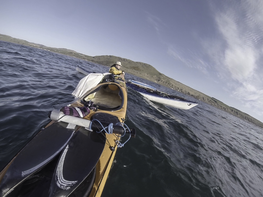 Sea kayaking with Assisted reentry after a capsize with a Flat Earth kayak sail.