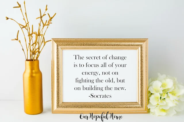 Socrates quote about change in gold frame. 