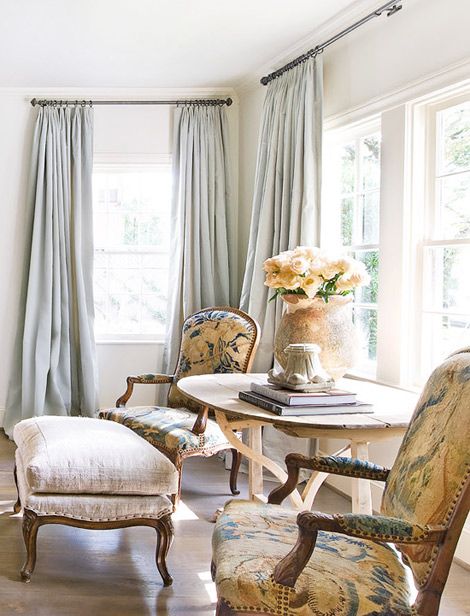 Elegant antique arm chairs in sitting area by Eleanor Cummings