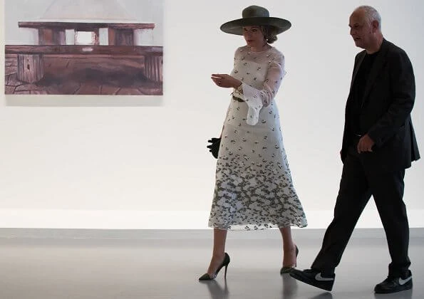 Queen Mathilde wore an embroidered tulle midi dress by Natan. Natan is a fashion house by Edouard Vermeulen. Queen Elizabeth