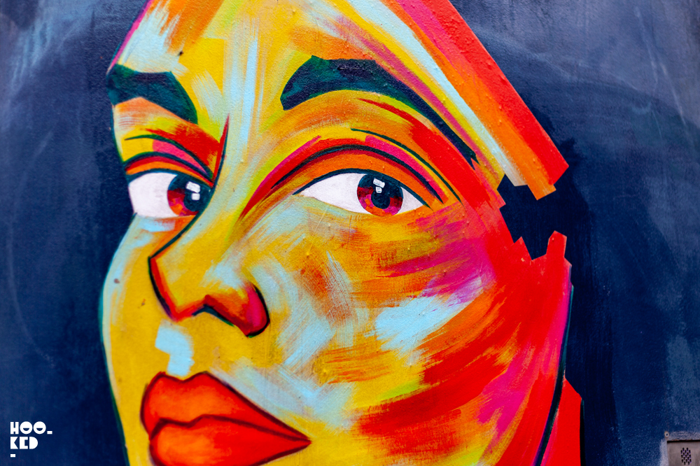 Close up of a painted face by French Street Artist Manyoly