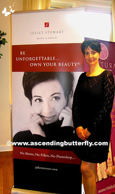 Juliet Stewart stands by her display at The Beauty Press Spotlight Day at Midtown Loft in New York City