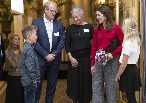 Danish Crown Princess Mary wore Hugo Boss Banora8 blouse and wool trousers at Hotel d'Angleterre in Copenhagen. Danish Heart Association