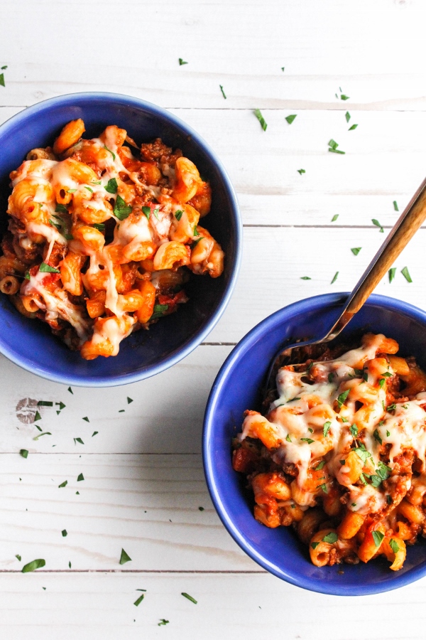 This pizza pasta is made with six ingredients in one skillet and it's ready in less than 30 minutes! It's a perfect meal for any night of the week and one that the whole family will love!
